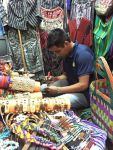 Diego works on bracelets for The PEACH Pit at his shop in Antigua, Guatemala.