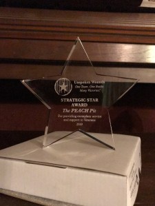 Acrylic star with "Strategic Star Award" and "The PEACH Pit" etched in it.